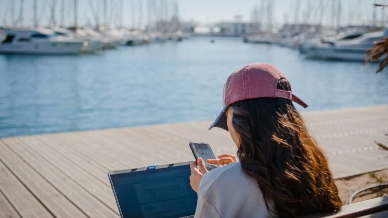 Remote worker with a laptop by the marina in Alicante, Spain – fastest digital nomad visa process
