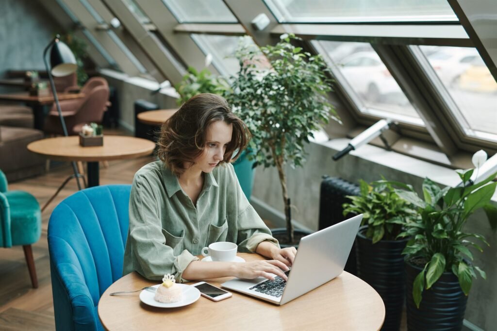 Remote worker with laptop in a Madrid cafe - Spain digital nomad visa 2026 guide