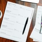 Application forms and a pen on a desk – TIE card Spain application guide