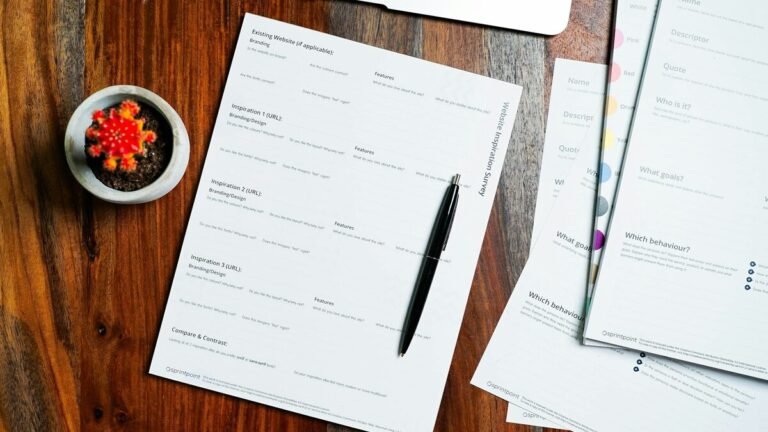Application forms and a pen on a desk – TIE card Spain application guide